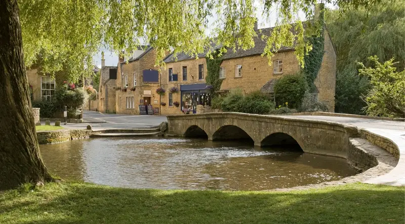 Low stone bridge over the River Windrush at Bourton-on-the-Water, a classic Cotswolds village