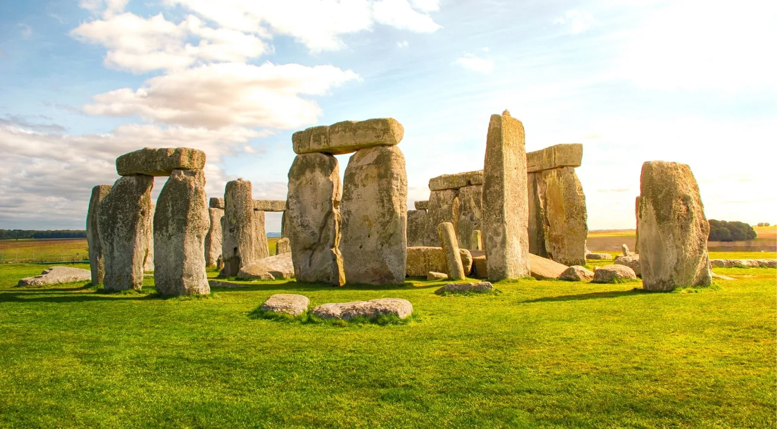 The great sarsen stone circle of Stonehenge standing on Salisbury Plain under a wide sky