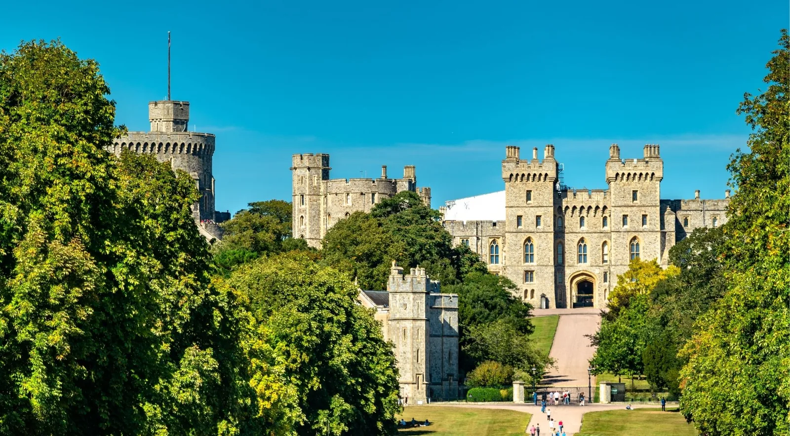 Windsor Castle's Round Tower and stone battlements rising above the town under a clear sky